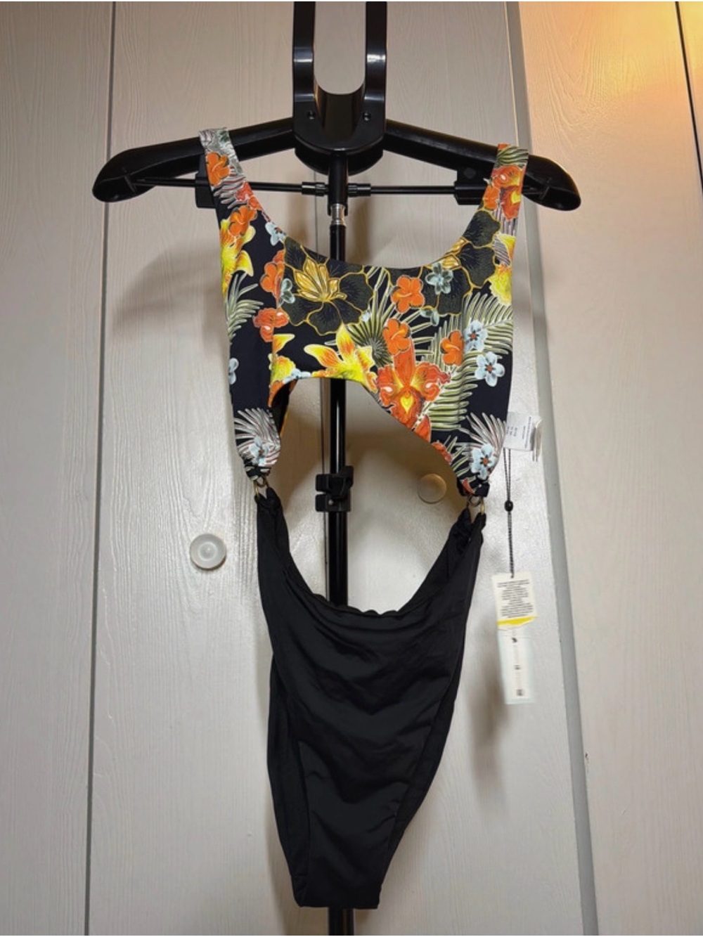 The Bikini Lab Black One-Piece with Yellow & Orange Tropical Floral Top
